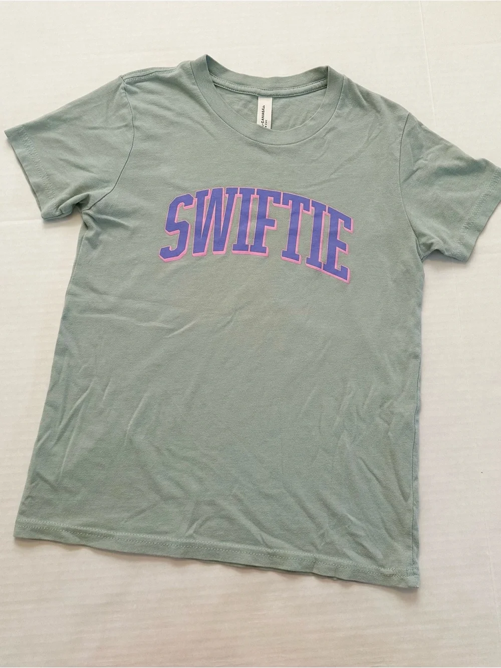 Bella+Canvas Sage Green SWIFTIE Tee with Purple-Pink Graphic